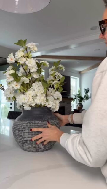 Here’s how to ease from winter into spring decor — without buying all new things. 🌿

You don’t need a full refresh. Just a few intentional shifts.

If this helps, save it for when you start swapping things out.
1️⃣ Lighten the textiles�Swap heavy knits and dark throws for lighter neutrals, cottons, or soft stripes. Even folding away one chunky blanket can change the room.
2️⃣ Rotate, don’t replace�Move decor from one room to another. A lamp, tray, or vase often feels new in a different space.
3️⃣ Add one fresh element�Fresh (or faux) greenery, a simple branch in a vase, or a bowl of lemons on the counter adds life without buying “spring decor.”
4️⃣ Edit one surface�Clear one shelf, one console, or one corner. Removing visual weight instantly feels lighter than adding something new.
5️⃣ Shift the color balance
�Keep your base neutral. Add small touches of soft green, pale blue, or warm white through pillows, napkins, or florals.

Spring doesn’t have to mean shopping.�Sometimes it just means simplifying.

If you’d like more practical home ideas follow along! #homedecorlovers #simplify #springhomedecor