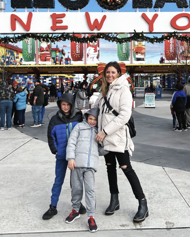 A woman and two children posing for the camera.