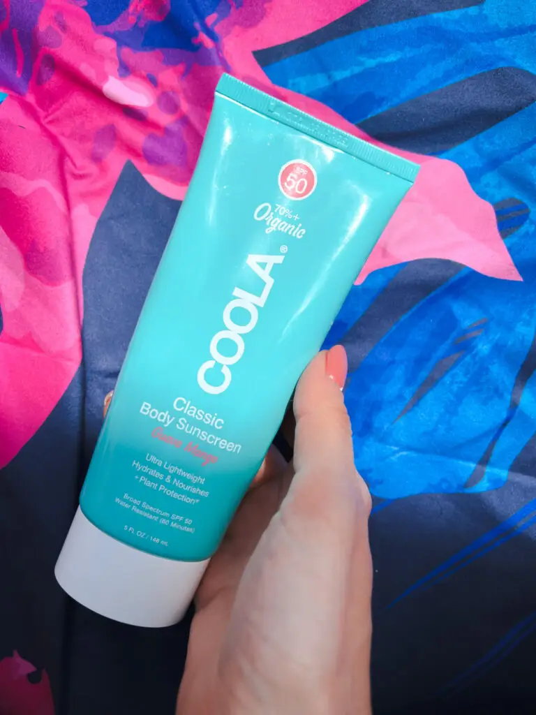 25-of-the-best-travel-essentials-from-Amazon - Sweet Motherly A person holding up a tube of lotion.