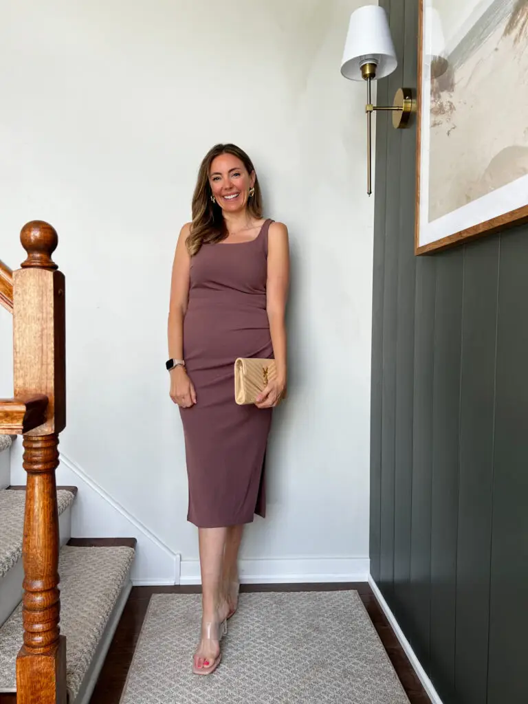 A woman standing on the stairs in her dress