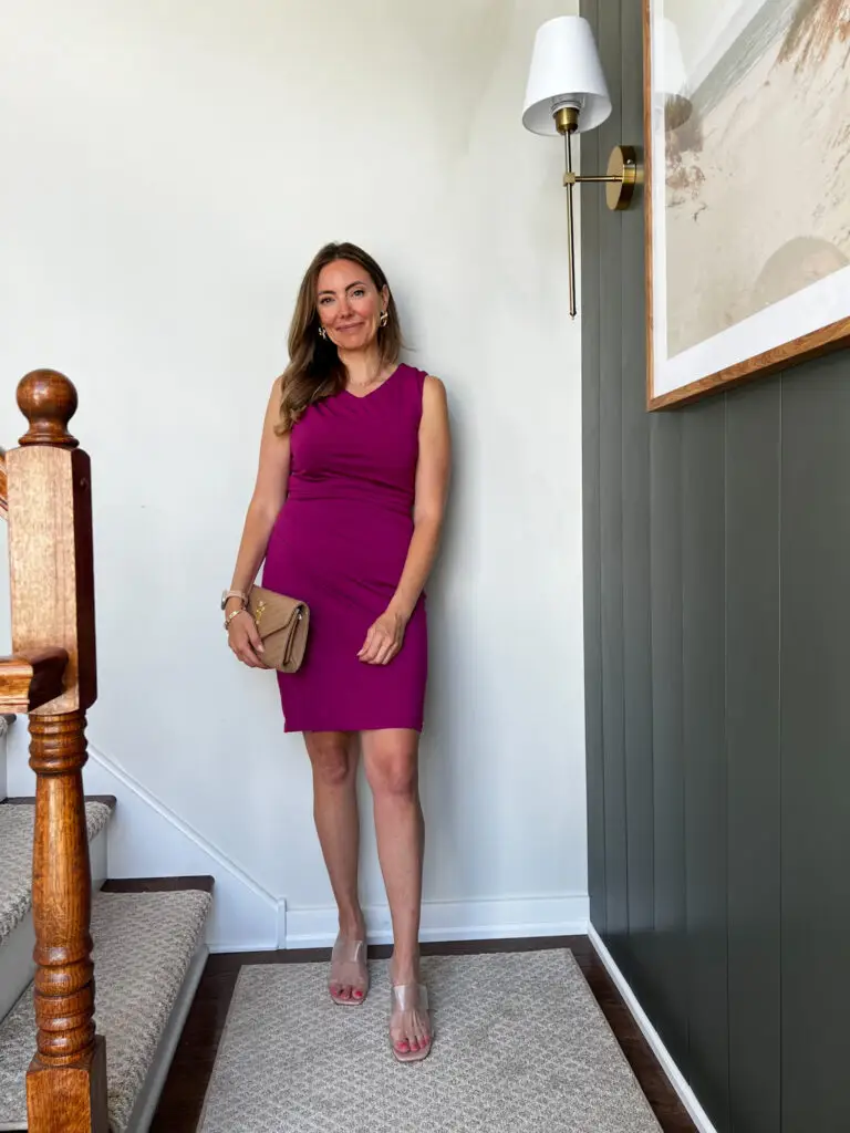 A woman standing on the stairs in her dress