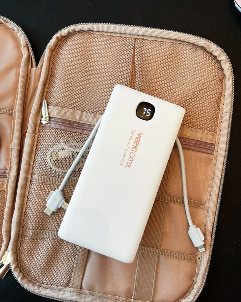 25-of-the-best-travel-essentials-from-Amazon - Sweet Motherly A white power bank sitting in an open case.