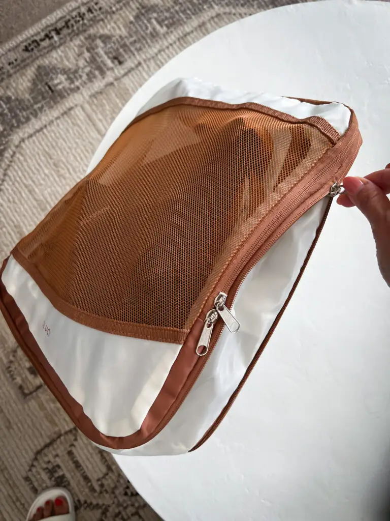 25-of-the-best-travel-essentials-from-Amazon - Sweet Motherly A person holding onto the inside of a bag