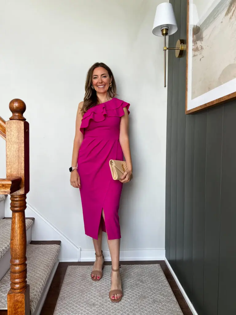 IMG_7529 - Sweet Motherly A woman in a pink dress standing on stairs.