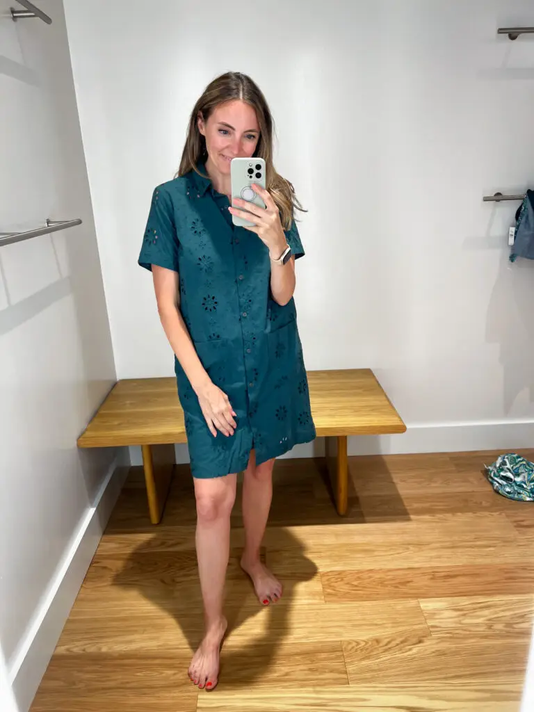 A woman taking a selfie in front of the mirror.