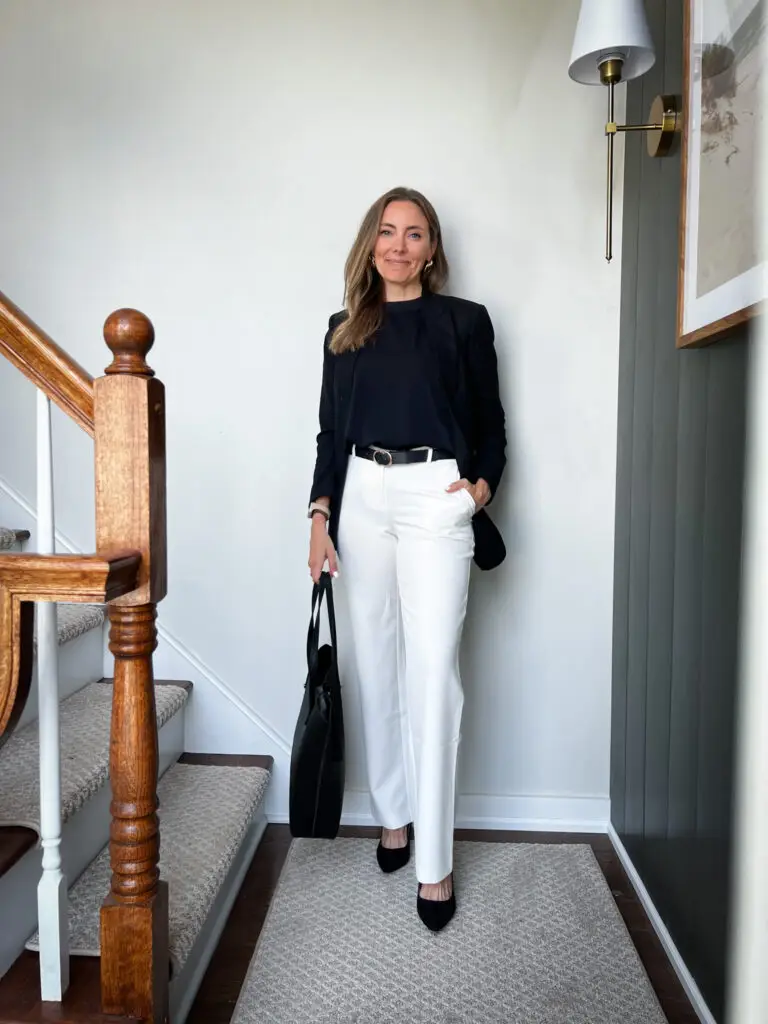 IMG_8998 - Sweet Motherly A woman standing on the stairs wearing white pants.