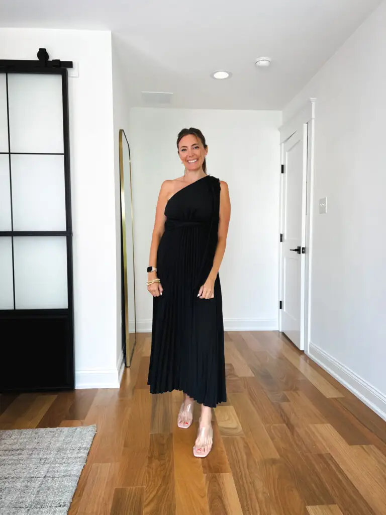 20-Affordable-Wedding-Guest-Dresses-for-Fall - Sweet Motherly A woman standing in front of a door wearing black.