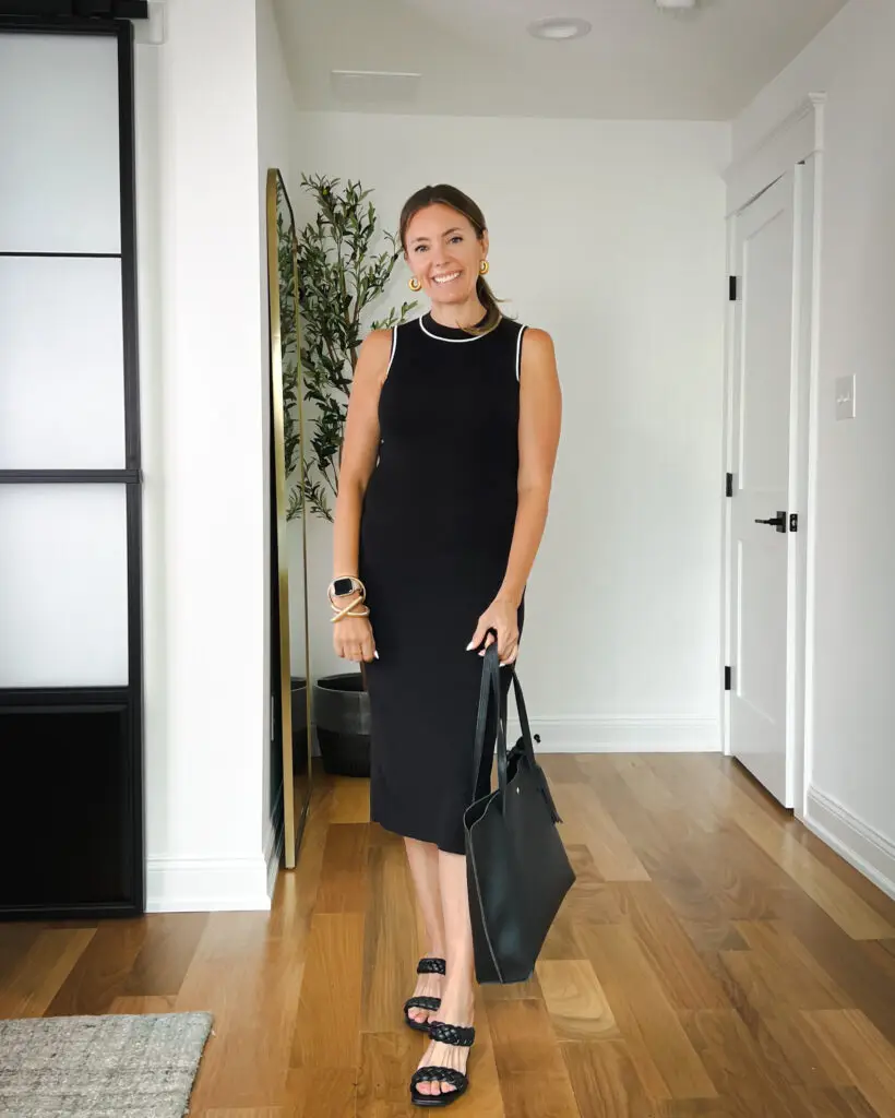 25-affordable-fall-work-wear-and-teacher-outfits - Sweet Motherly A woman in black dress holding a bag.