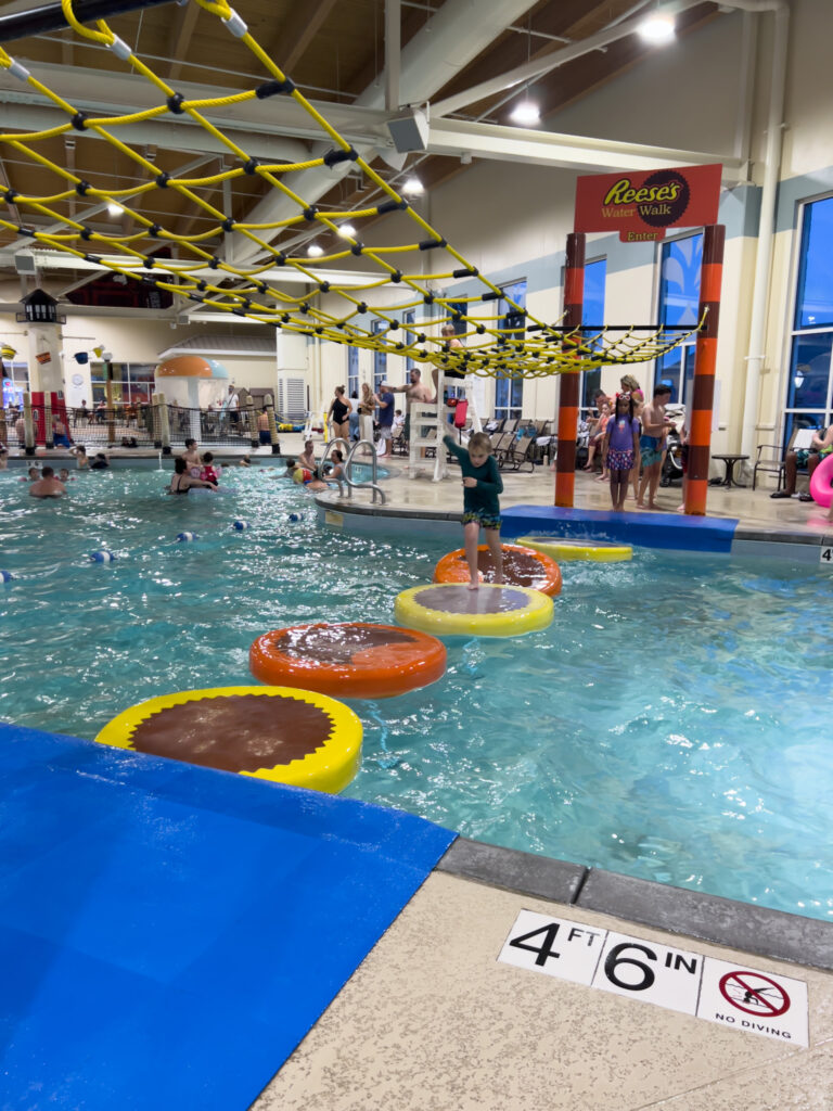 A group of people in an indoor pool.