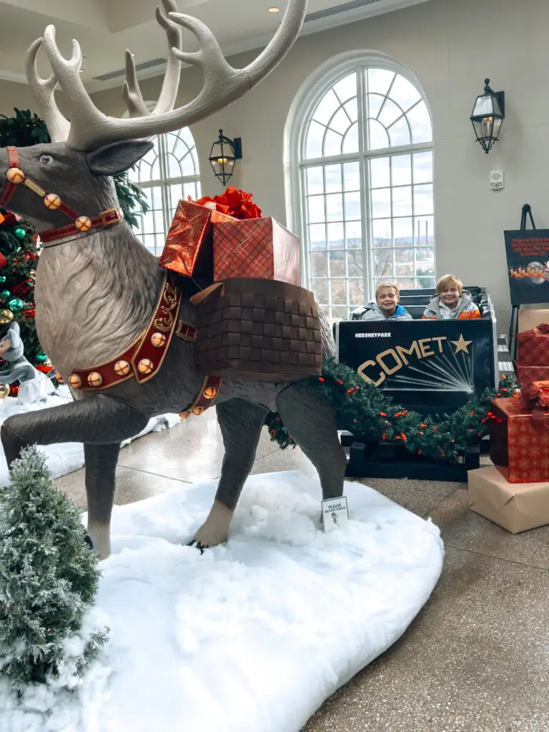 The-Ultimate-Weekend-in-Hershey-Holiday-Getaway-Guide - Sweet Motherly A large reindeer statue in the middle of snow.