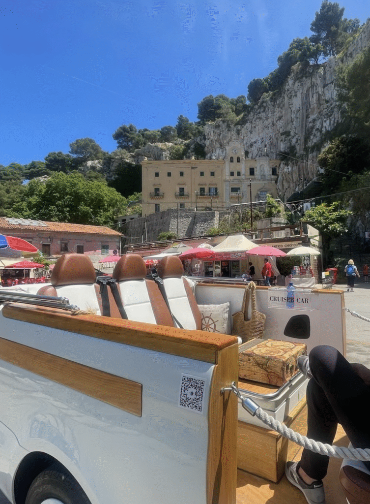 Market Views from CruiserCar Seats in Palermo - Sweet Motherly CruiserCar seats with woven bag and market view at the base of a Palermo cliffside village.