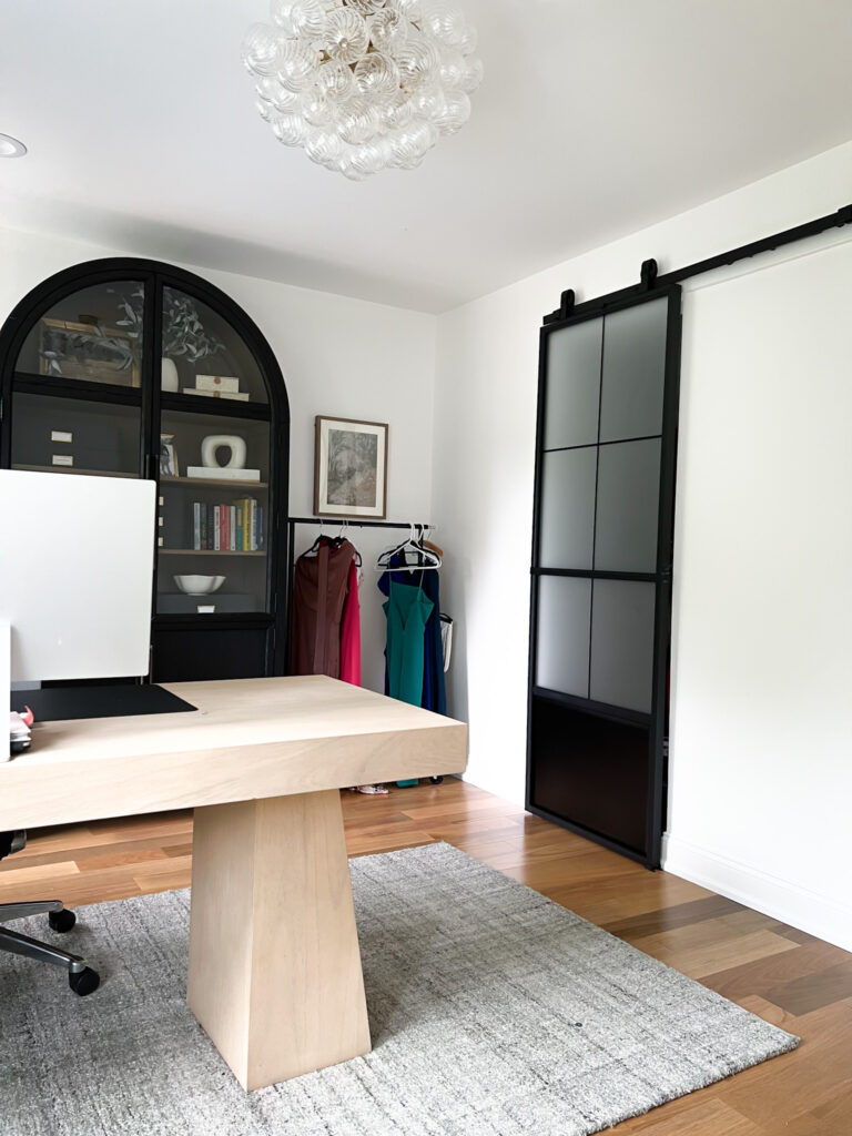 Modern matte black barn doors in a stylish home office for added privacy and clean design