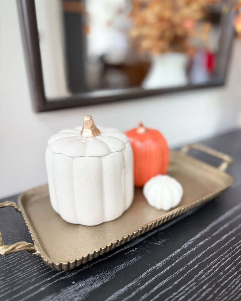 IMG_4357 - Sweet Motherly Close-up of gold tray with white and orange pumpkins on black console table for fall decor