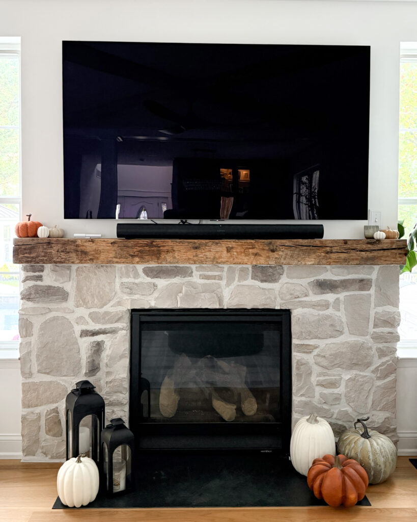 IMG_4388 2 - Sweet Motherly Stone fireplace decorated for fall with lanterns, pumpkins, and wooden mantel
