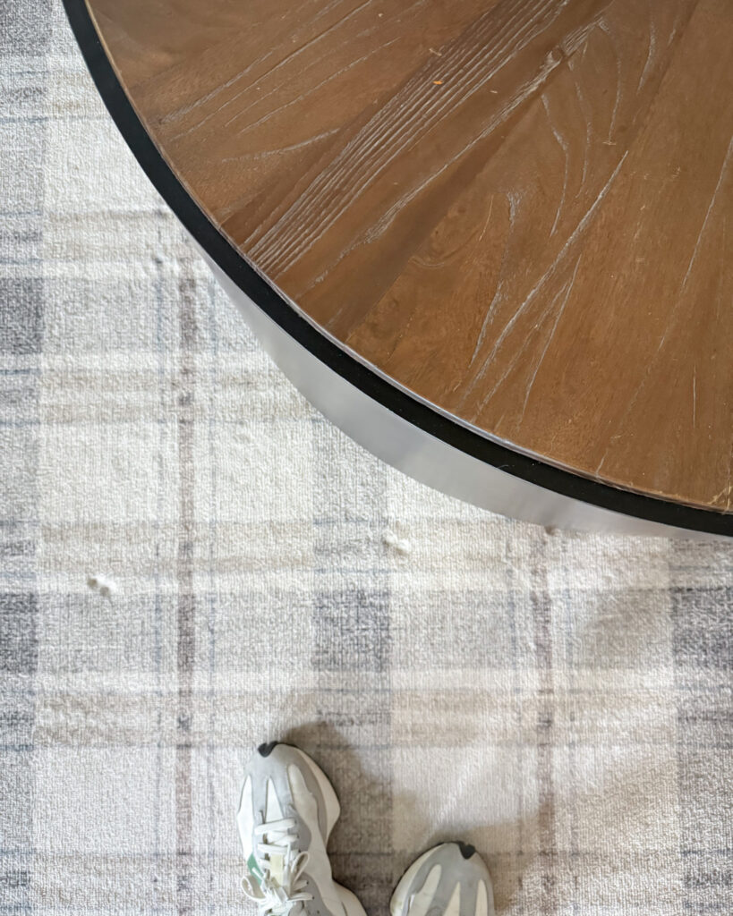 IMG_4416 - Sweet Motherly Close-up of neutral plaid rug and round wooden coffee table with cozy fall textures