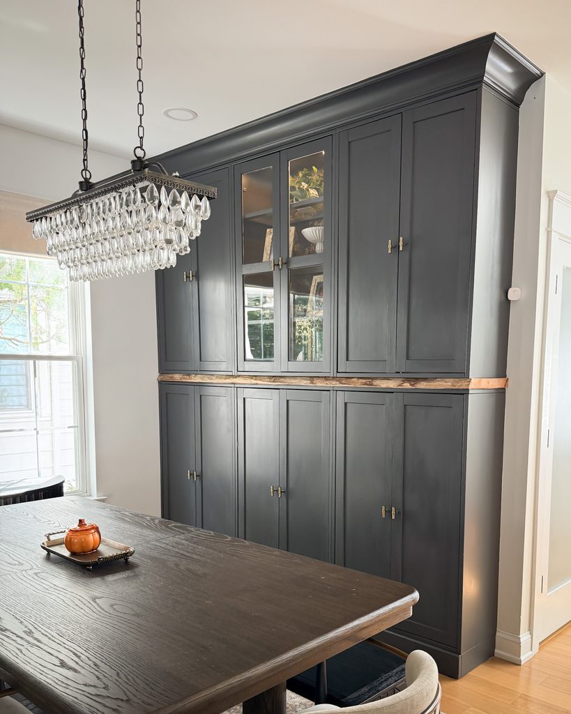 Crown molding added to the top of IKEA Havsta cabinets for a custom built-in look